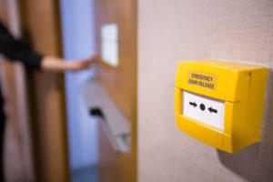 Emergency door switch release for fire exit.